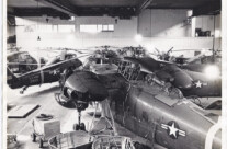 Helicopter maintenance work being done in a hanger at the Flugplatz