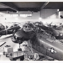 Helicopter maintenance work being done in a hanger at the Flugplatz