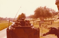 Armored convoy moving across the German countryside