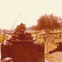 Armored convoy moving across the German countryside